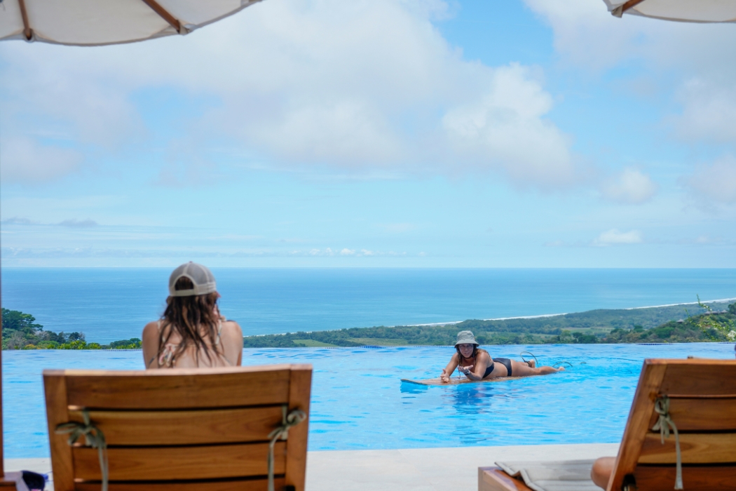 Surf lessons in the infinity lap pool in Costa Rica at Lamangata Luxury Surf Resort