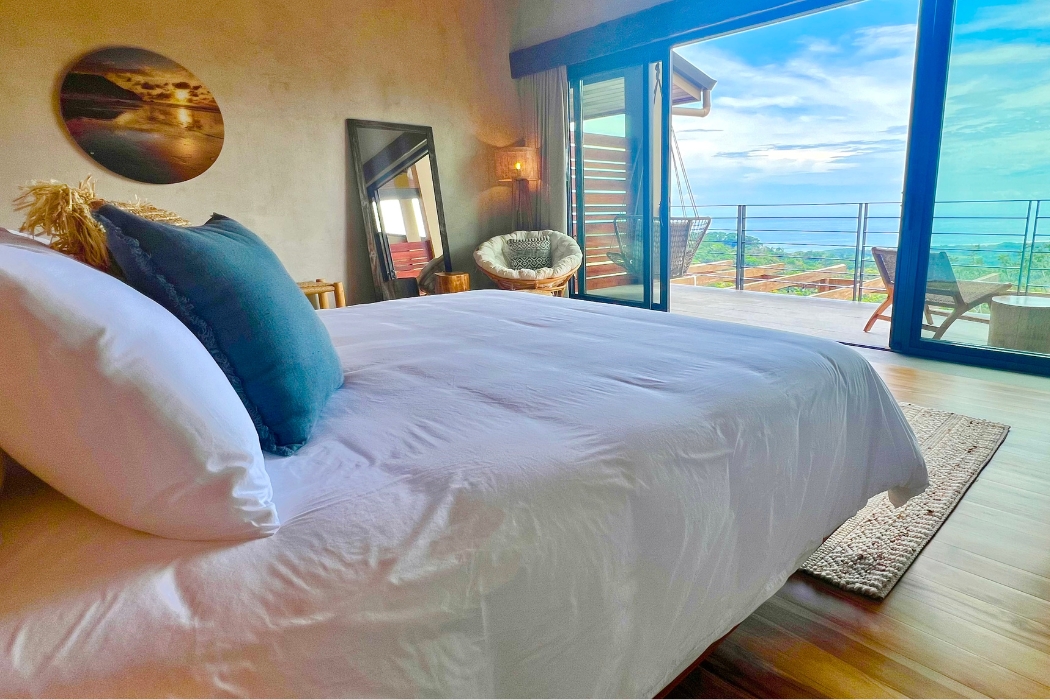 Ocean view room with king bed at Lamangata Luxury Surf Resort in Costa Rica