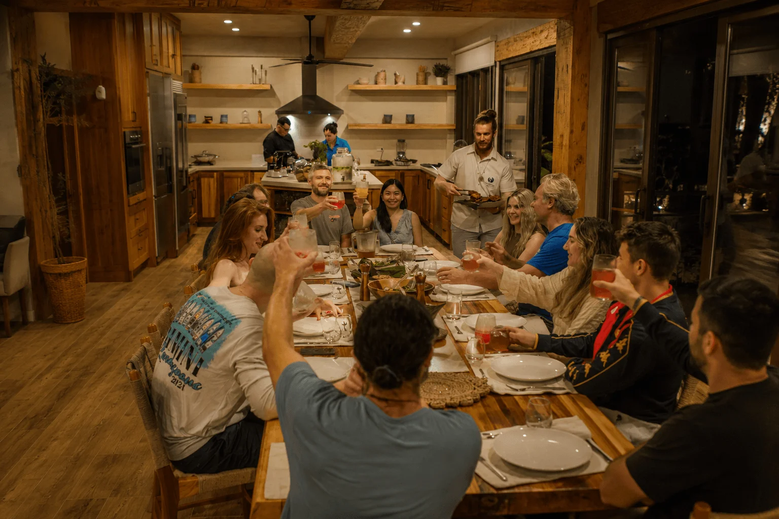 Guests enjoying group dinner at Lamangata Surf Resort